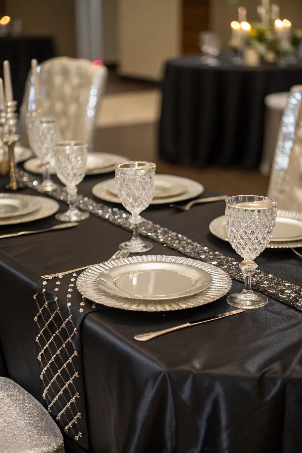 A beautiful tablescape featuring black and silver elements.