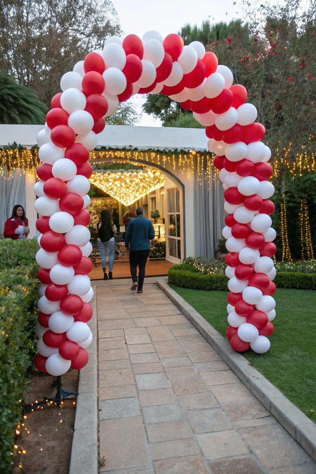 Greet your attendees with an endearing candy cane balloon gateway.