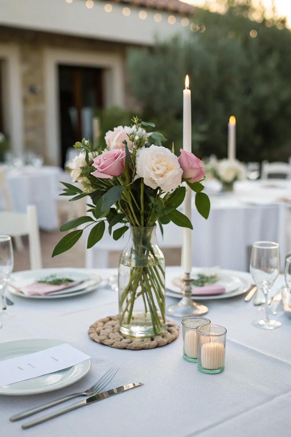 Simple vase with peonies adds elegance to the table setting.