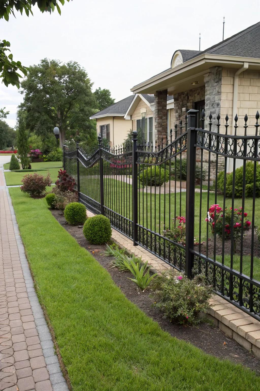 A closed wrought iron fence ensuring privacy in a stylish front yard.