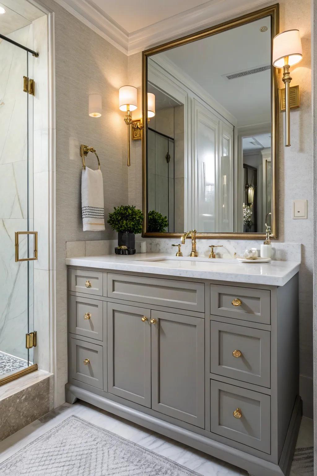 Brass fixtures add a warm, elegant touch to the grey vanity.