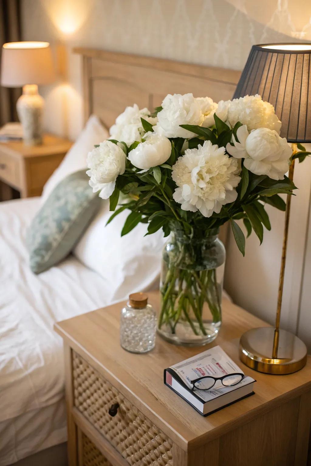 White peonies adding romance to a bedroom setting.