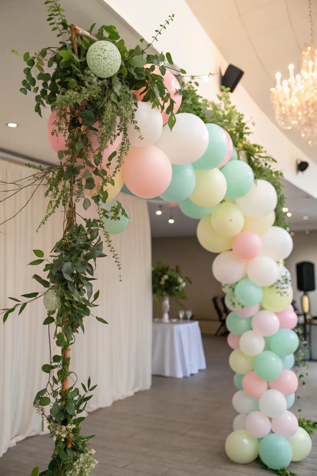 Balloon garlands with greenery create a lush and festive look.