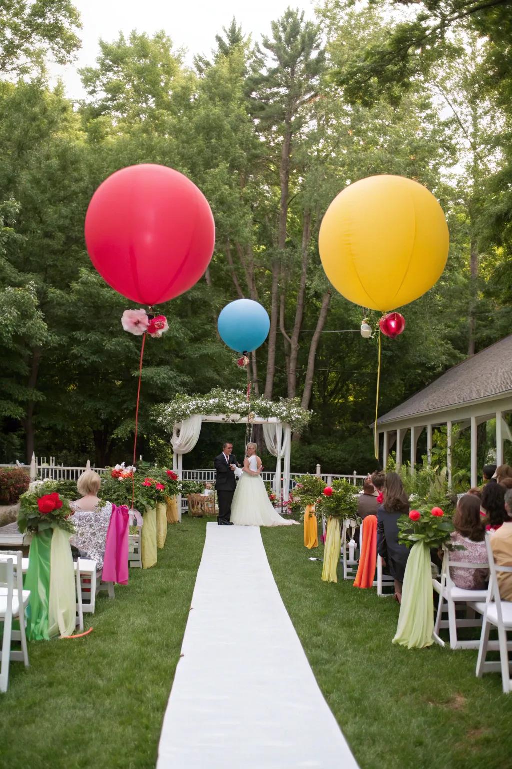 An outdoor wedding ornamented with colossal balloons in rainbow shades.
