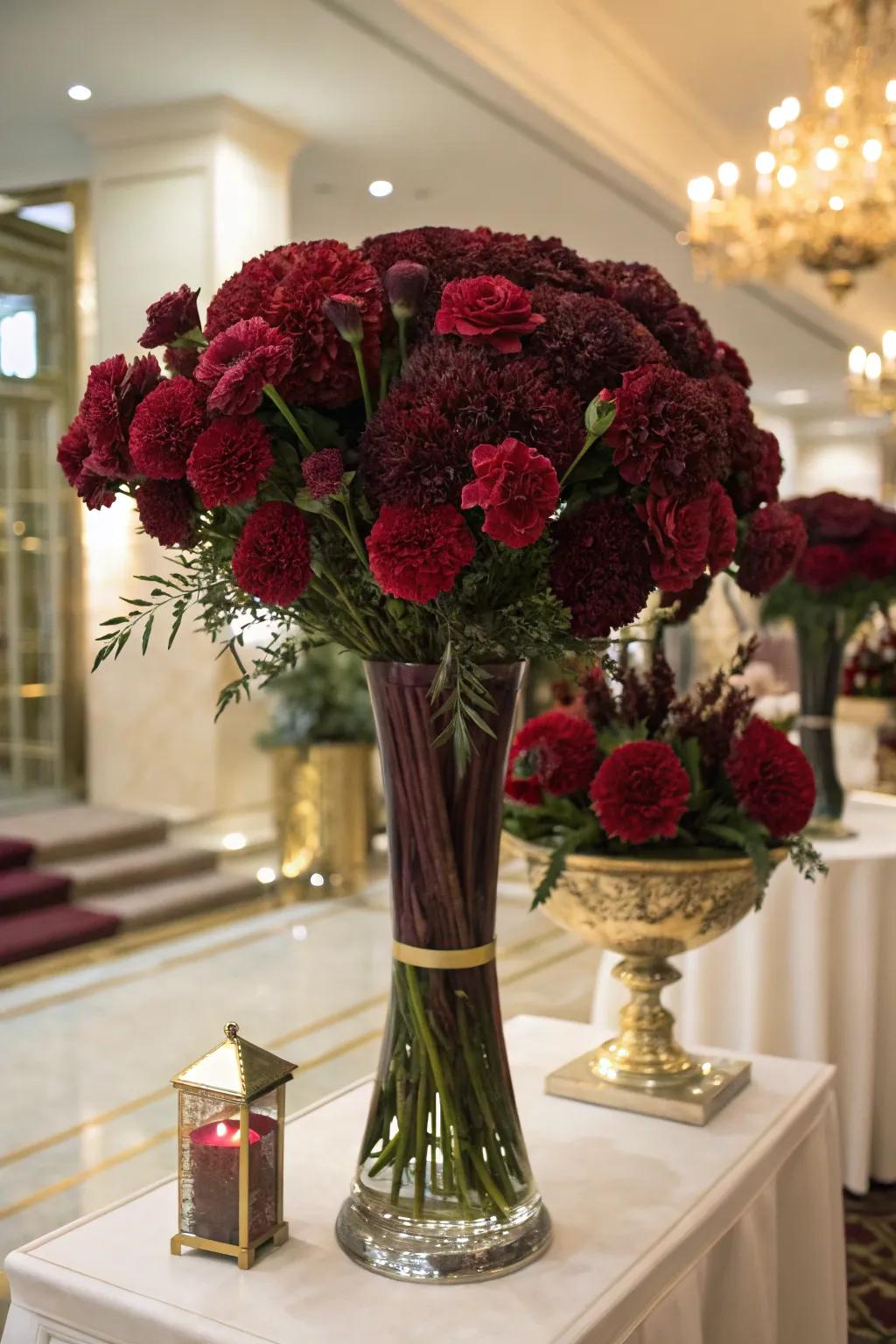 Burgundy carnations bring drama and elegance to any arrangement.