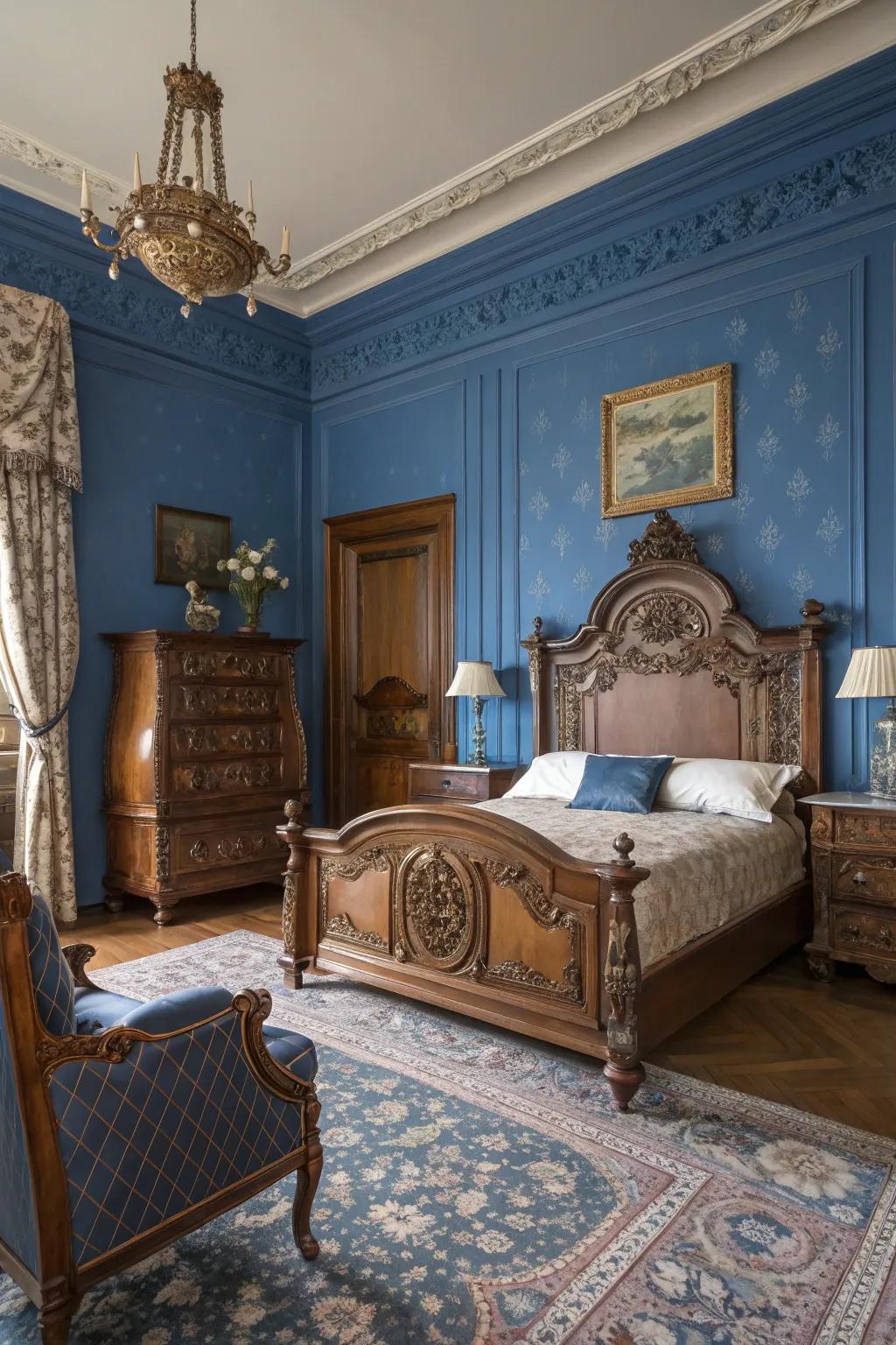 The antique furniture adds a royal charm to the modern royal blue bedroom theme.