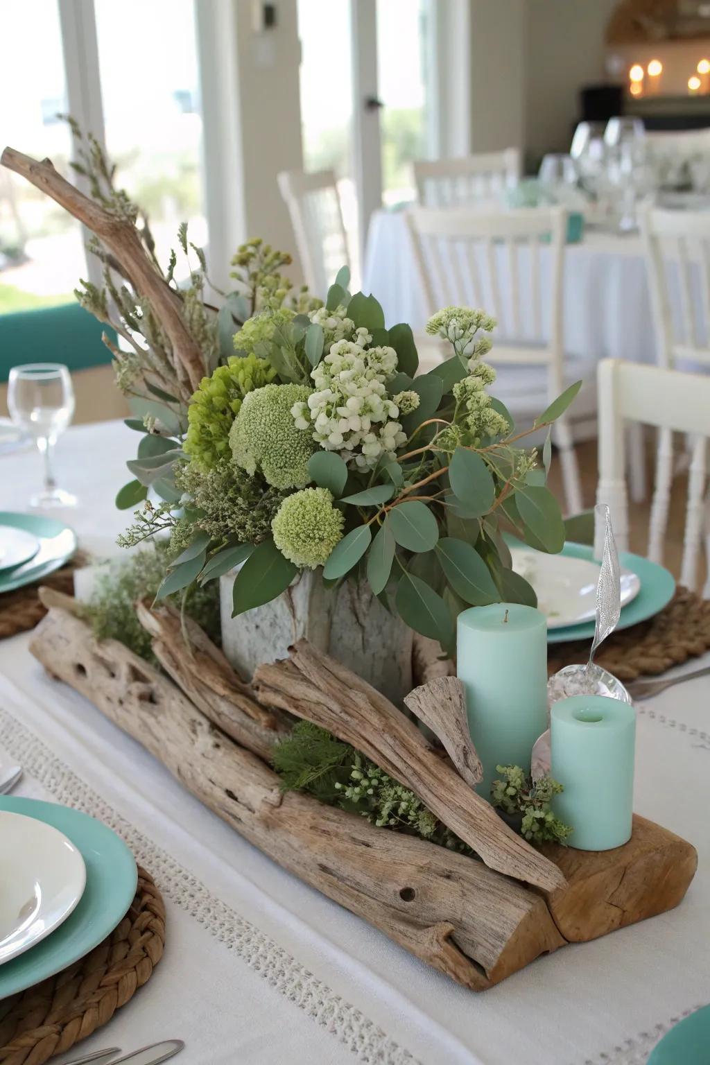 A coastally inspired centerpiece that melds driftwood with sage green for a laid-back essence.