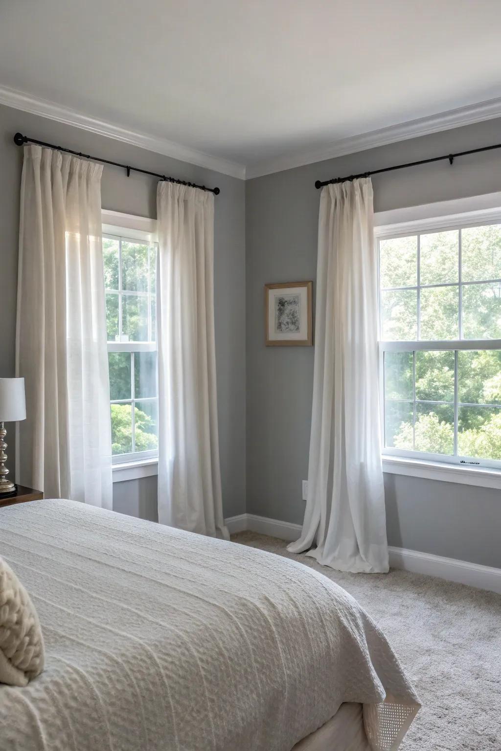 Sheer curtains soften the look of a Stone Echo bedroom.