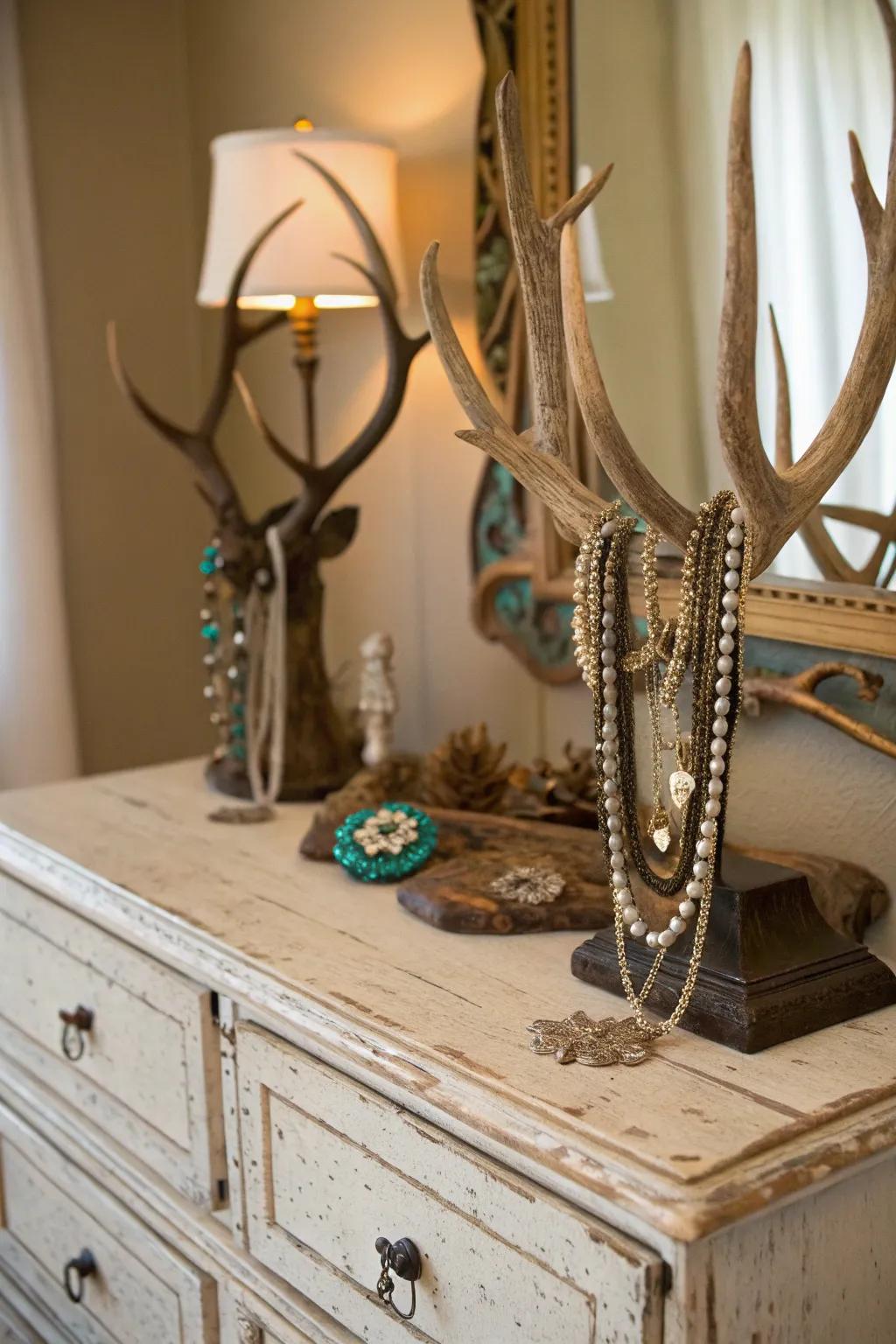 Deer antlers used as a bijoux display add functional style to a vintage dresser.