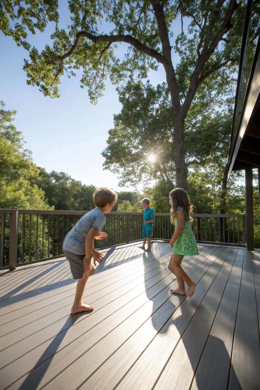 Kids enjoying time without shoes on a smooth synthetic deck, with sunlight streaming through the trees.