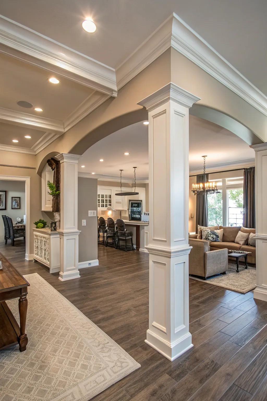 An open-layout living area with sizable crown molding, contributing a sense of grandeur and unity.