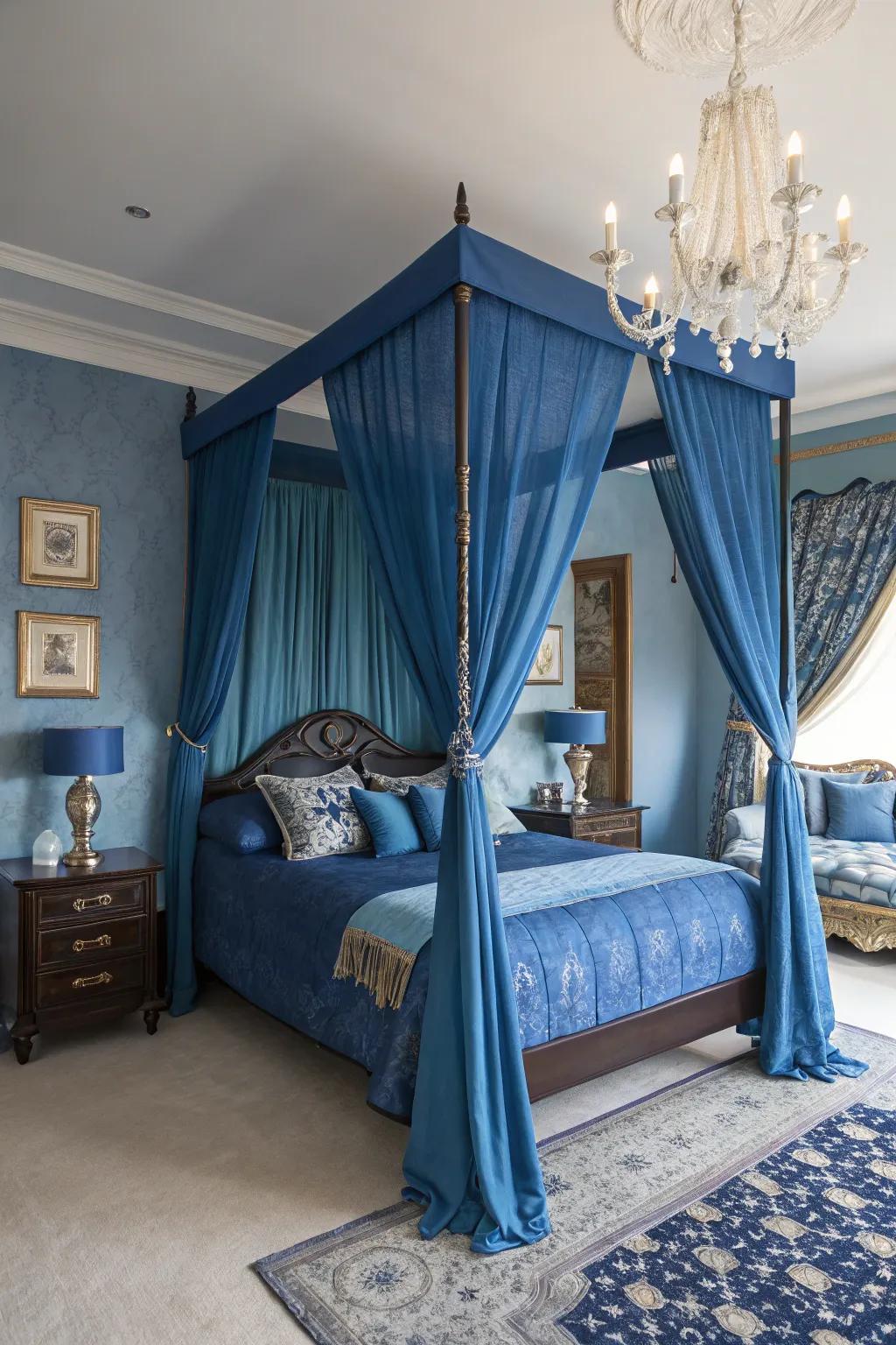 A canopy bed adds drama and timeless elegance to the royal blue bedroom theme.