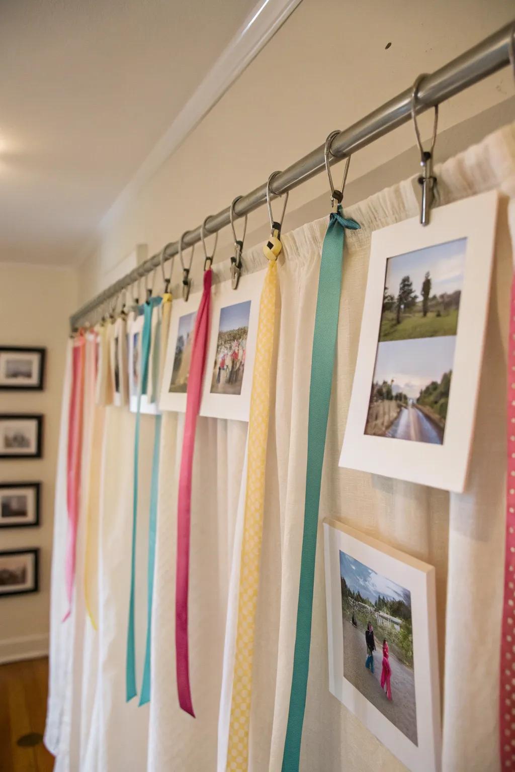 An elegant display using curtain rods and ribbons to hang pictures.