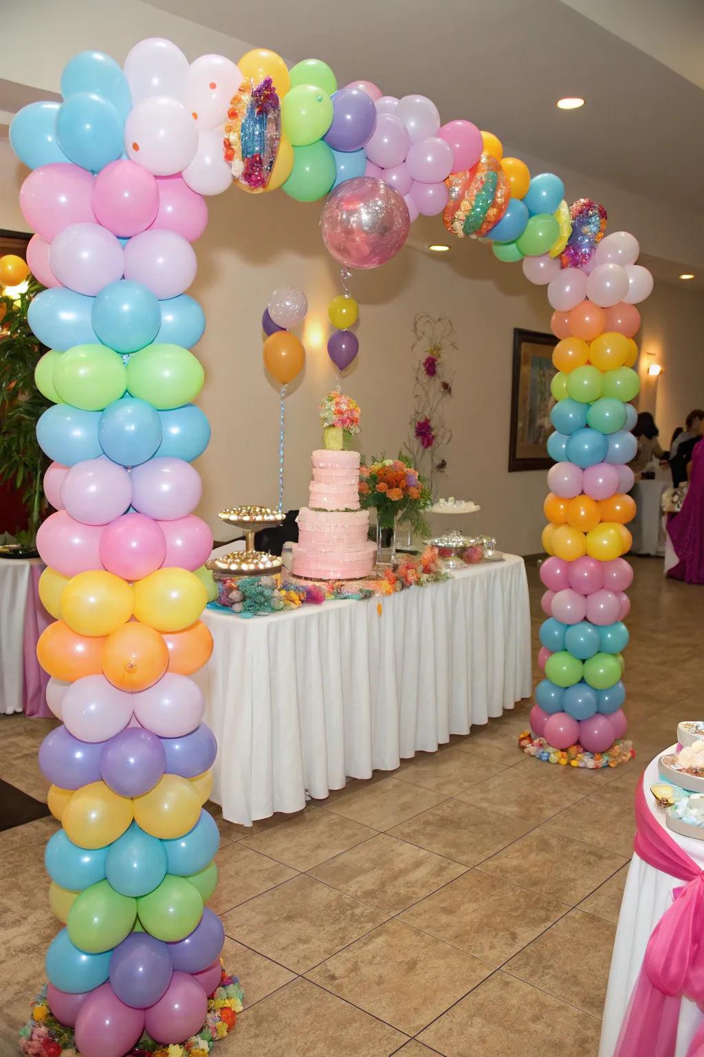 Balloon towers tastefully encircle the dessert exhibit.