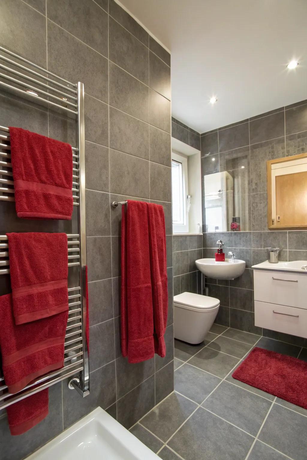 A bathroom showcasing silver tiles and a hint of scarlet.