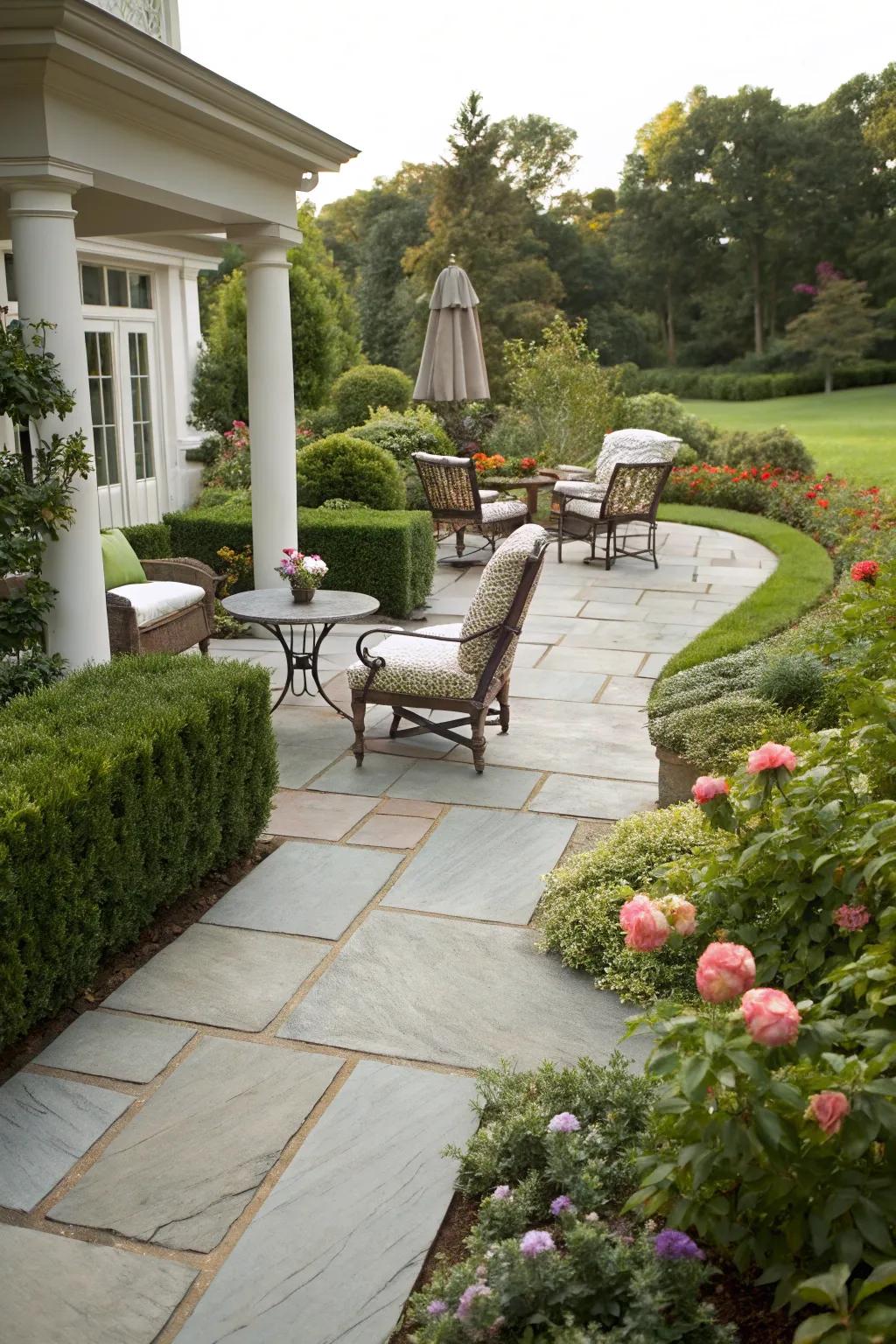 A cobblestone trail flawlessly connecting to a comfortable outdoor living space.